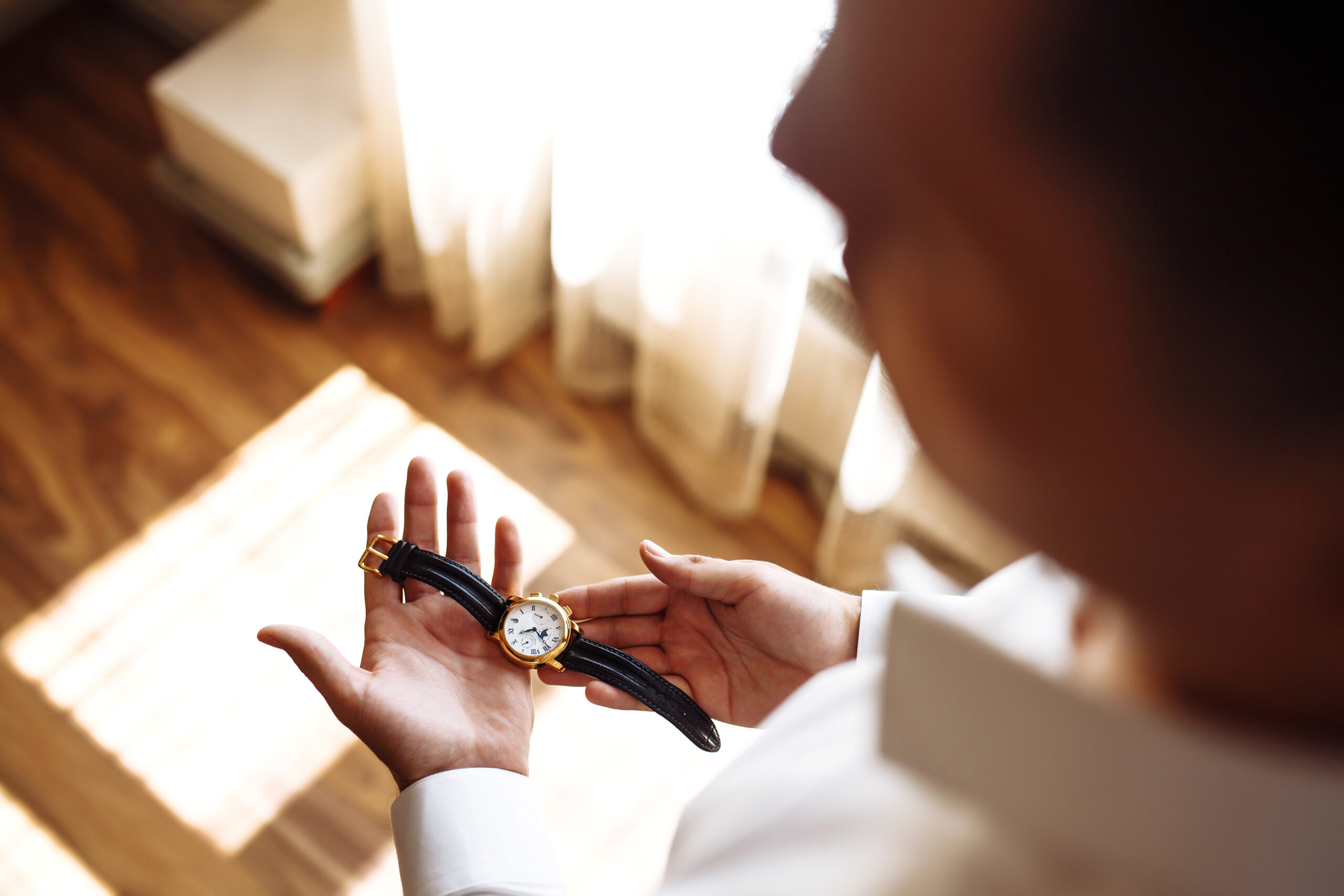 Stylish men's wrist watch, the man is watching the time. . Businessman checking time on his wristwatch.